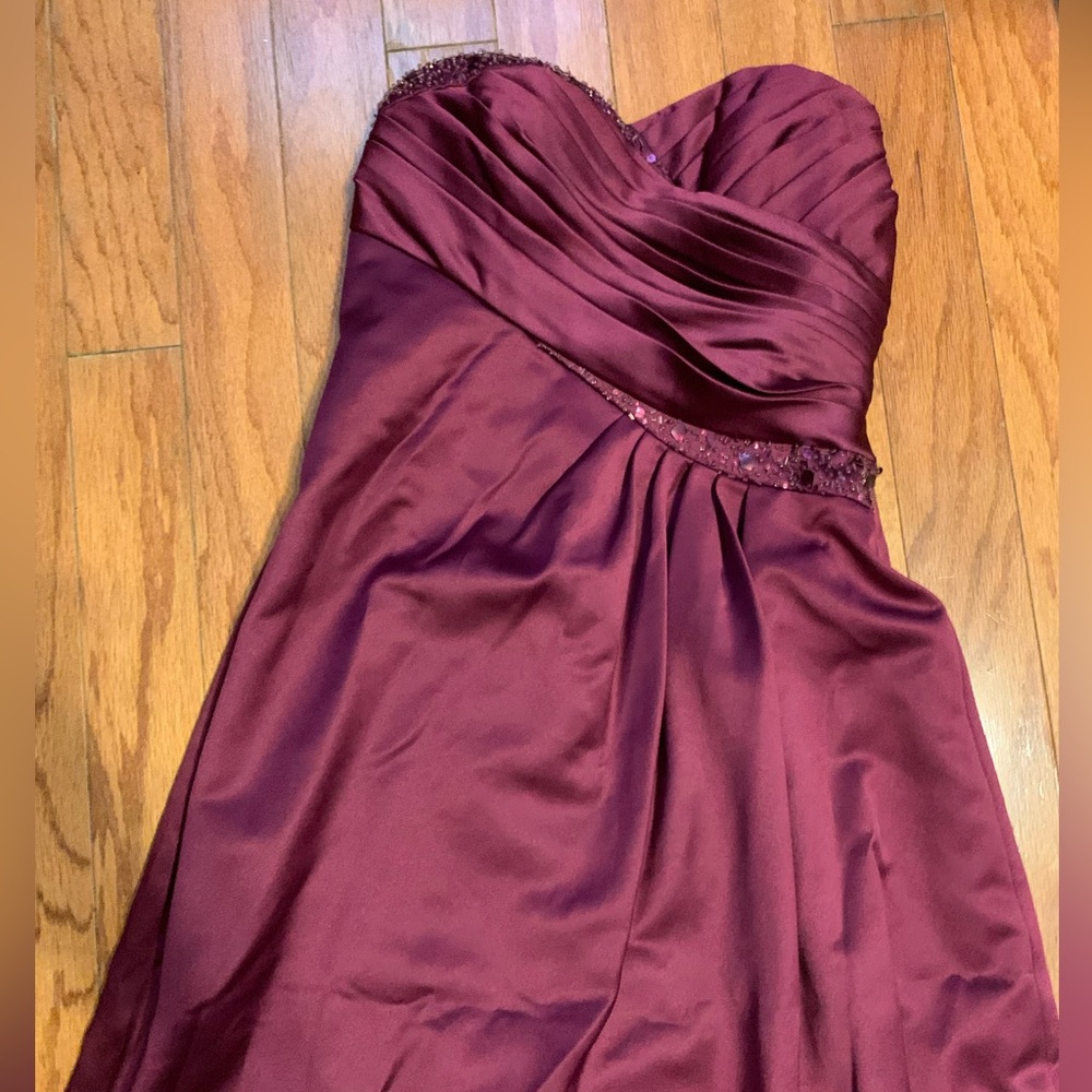 This is a maroon formal bridal dress